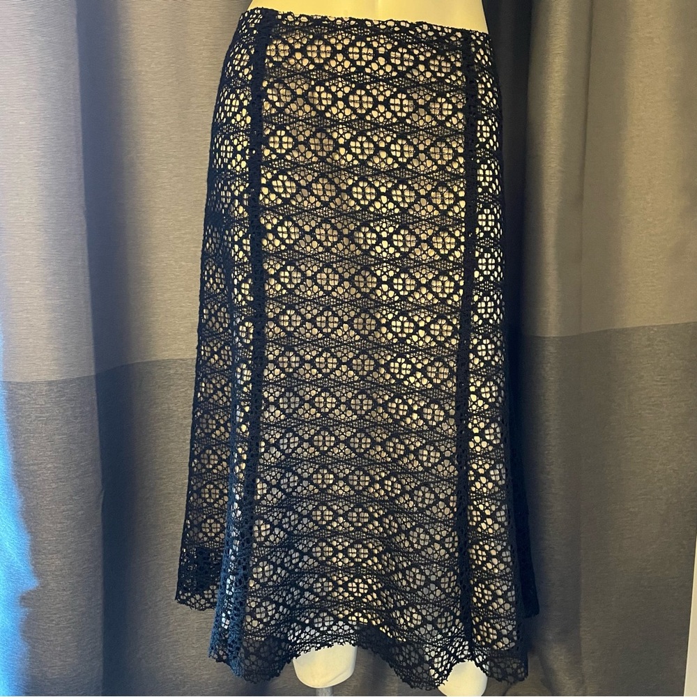 It’s a new vision black lace overlay skirt in GUC.  So elegant for anytime!  6US